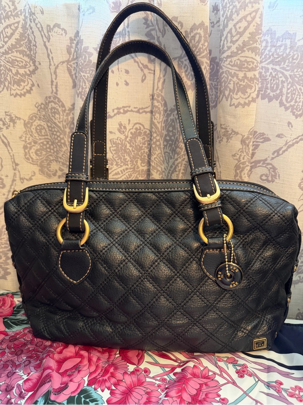 The Sak Black Quilted Leather Bag with Gold Accents